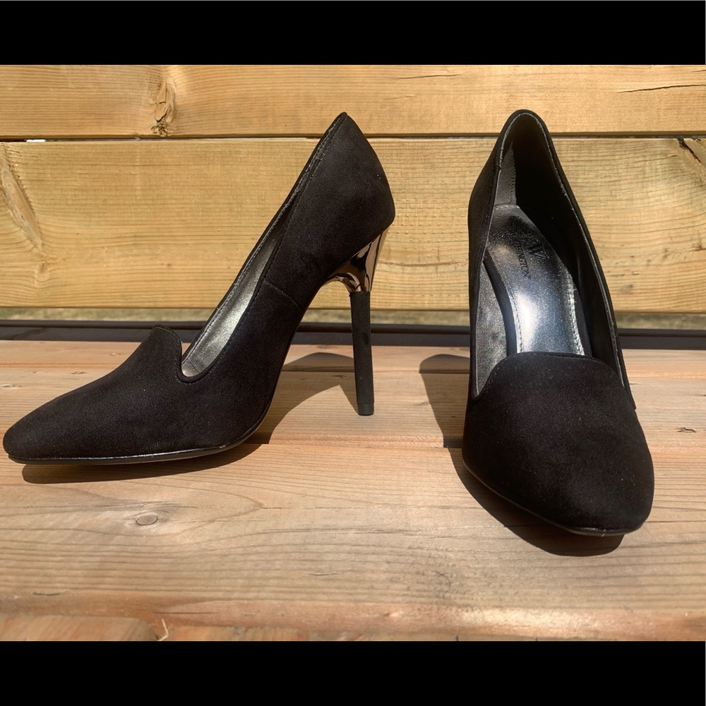 Black High-heel Closed Toed Shoe With Silver Detailing at top of Heel
